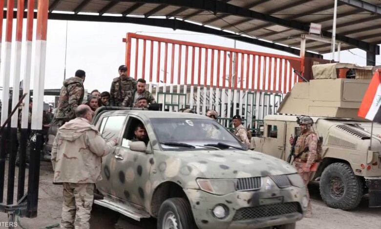 صورة وزارة الدفاع في بغداد: إعادة 1905 ضباط ومنتسبي الجيش إلى الجانب السوري